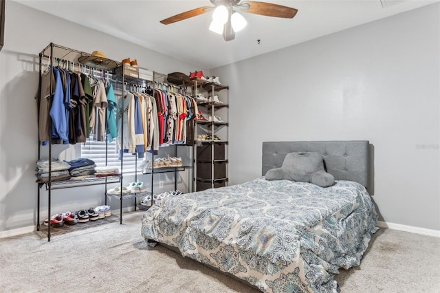 carpeted bedroom featuring ceiling fan