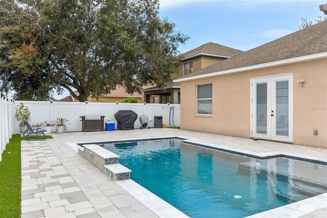 30552 Latourette Dr, Wesley Chapel, FL 33545 - view of pool featuring french doors, a patio area, a fenced backyard, and a grill