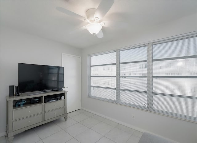 tiled living room featuring ceiling fan