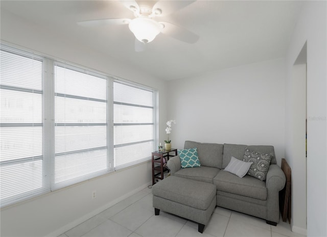 living room with ceiling fan and light tile patterned floors