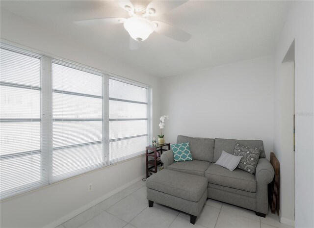 2960 59th St S Unit 509, Gulfport, FL 33707 - living room with ceiling fan, light tile patterned floors, and baseboards