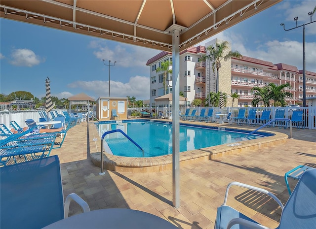 view of swimming pool with a patio