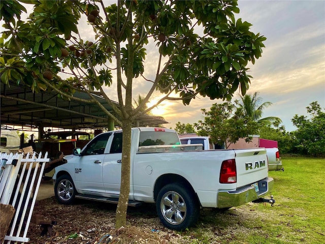 parking at dusk with a yard