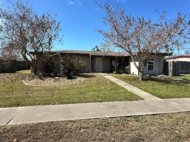 single story home with a front yard