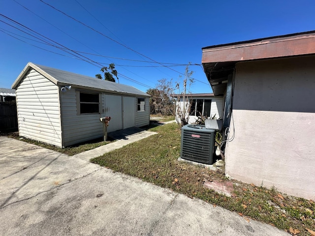 view of home's exterior featuring a yard and cooling unit