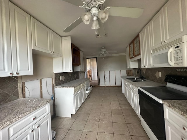 kitchen with decorative backsplash, sink, white cabinets, white appliances, and ceiling fan