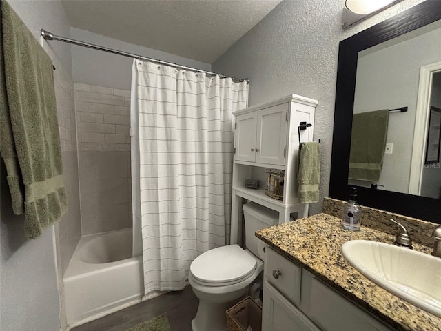 full bathroom featuring wood-type flooring, a textured ceiling, toilet, vanity, and shower / tub combo with curtain