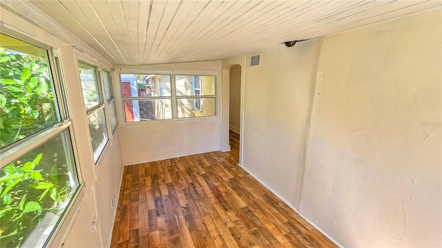 unfurnished sunroom with lofted ceiling and wood ceiling