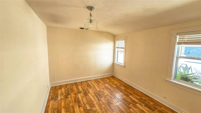 unfurnished room featuring dark hardwood / wood-style flooring