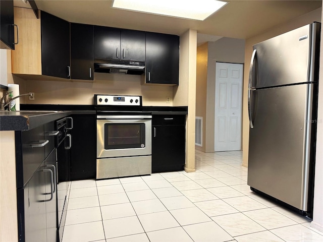 kitchen featuring stainless steel appliances, sink, and light tile patterned floors