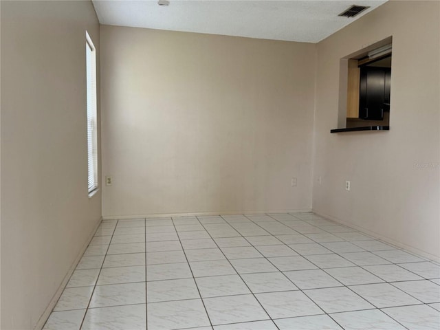 spare room featuring a textured ceiling