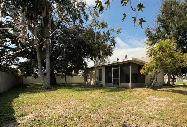 view of yard featuring a sunroom