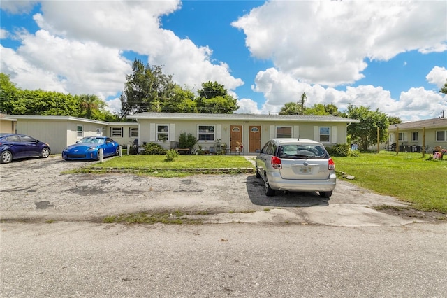 205 Santurce Ave, North Port, FL 34287 - ranch-style house featuring a front lawn