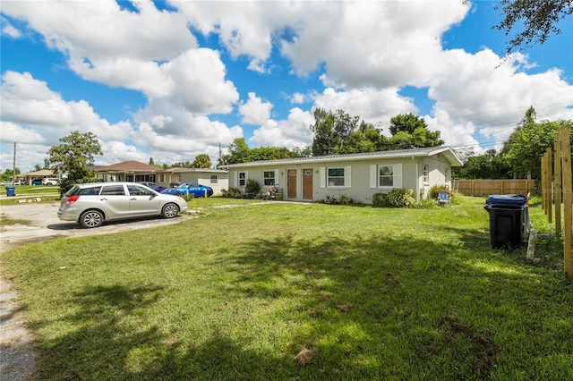 ranch-style home with a front yard