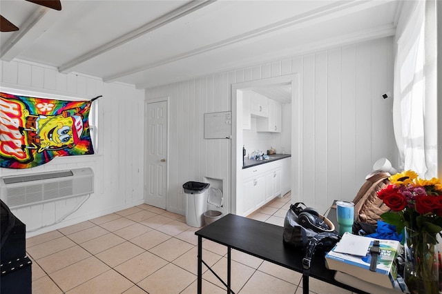 205 Santurce Ave, North Port, FL 34287 - interior space featuring a wall mounted air conditioner, beamed ceiling, a ceiling fan, and light tile patterned floors