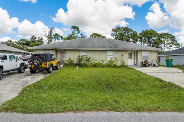 ranch-style home featuring a front yard