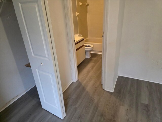 304 Camillia Ln Unit B, Port Charlotte, FL 33954 - hall with dark wood-style flooring and baseboards