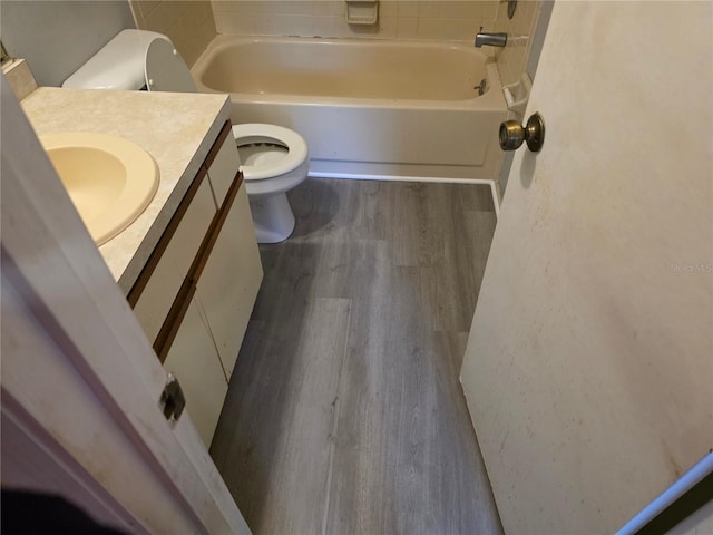 304 Camillia Ln Unit B, Port Charlotte, FL 33954 - bathroom featuring toilet, wood finished floors, vanity, and  shower combination