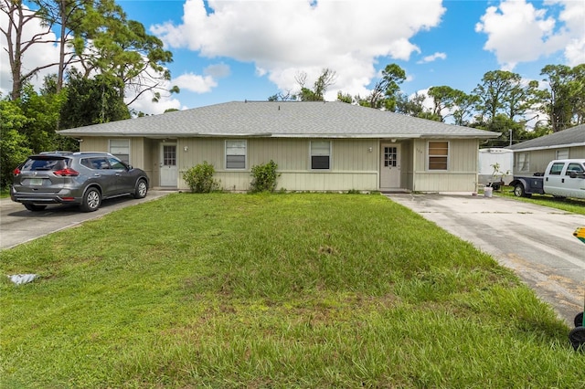 single story home featuring a front yard