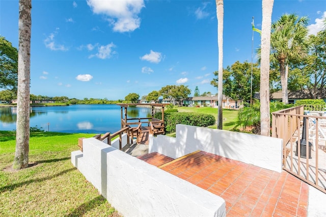 view of patio with a water view