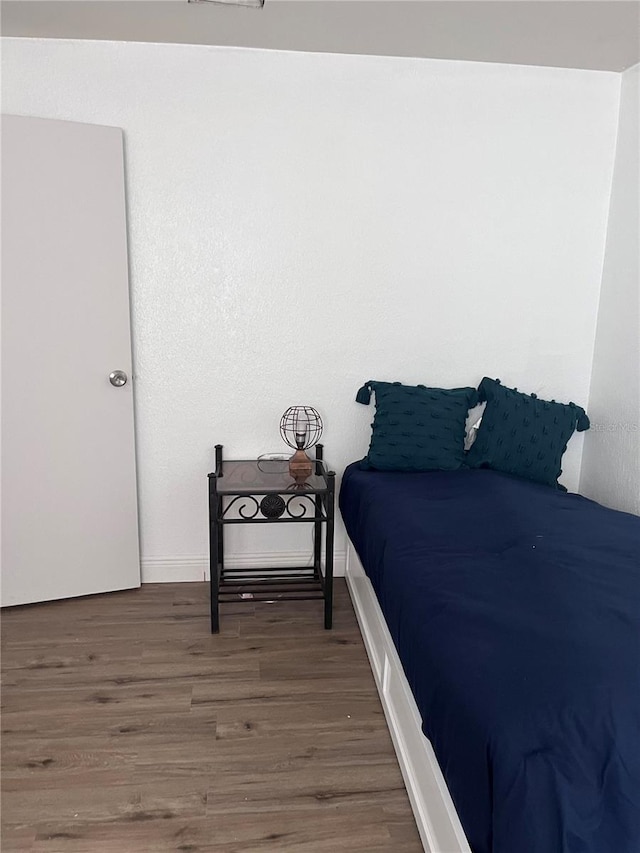 bedroom with hardwood / wood-style floors