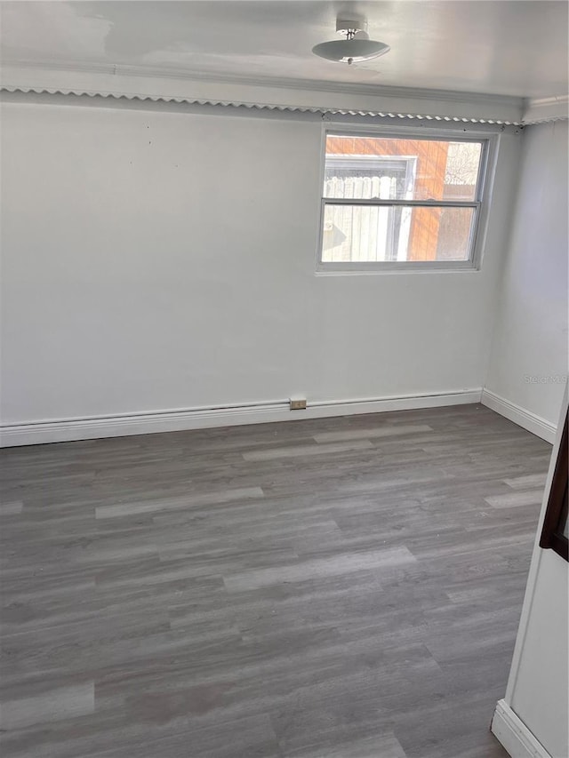 unfurnished room with hardwood / wood-style floors