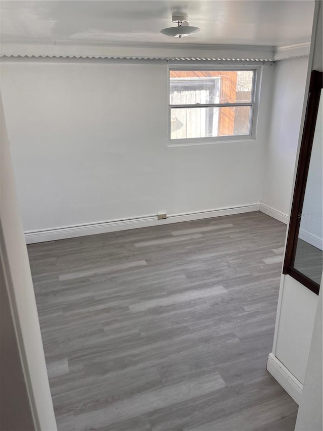 unfurnished room with plenty of natural light and hardwood / wood-style flooring