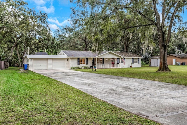 ranch-style home with a garage, a front lawn, and a porch