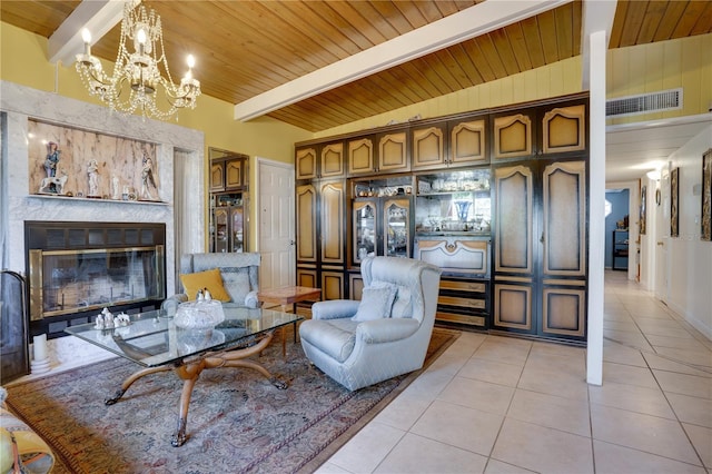 sitting room featuring wooden ceiling, high vaulted ceiling, light tile patterned floors, a notable chandelier, and beam ceiling