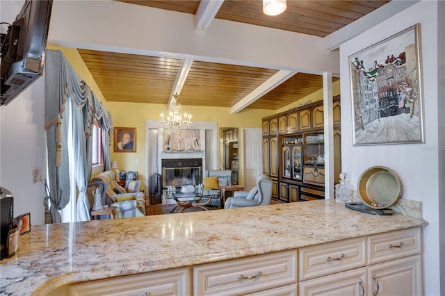 kitchen with beam ceiling, wooden ceiling, and a premium fireplace