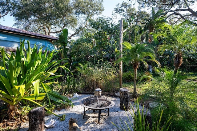 view of patio / terrace featuring an outdoor fire pit