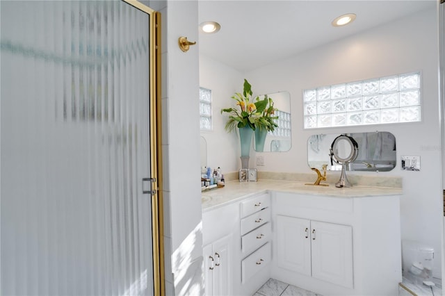 bathroom featuring an enclosed shower, vanity, and toilet