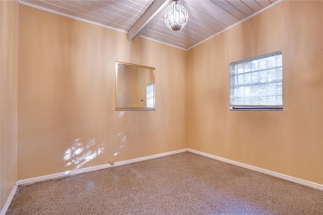 spare room featuring beamed ceiling, wood ceiling, carpet, and a chandelier