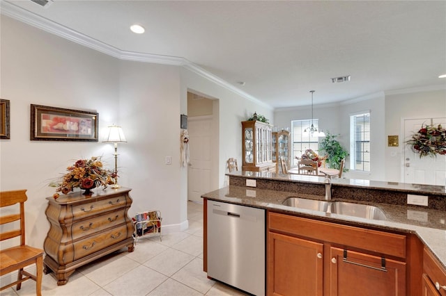 kitchen with crown molding, stainless steel dishwasher, dark stone countertops, and sink