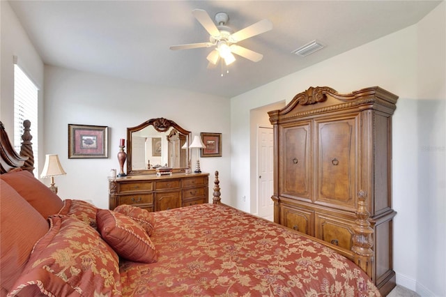 bedroom featuring ceiling fan, baseboards, and visible vents