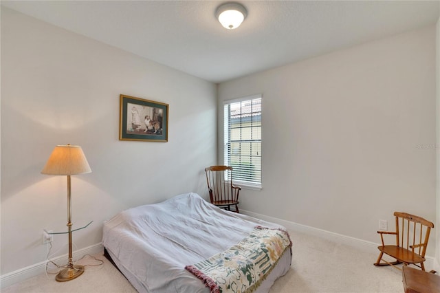 bedroom featuring light colored carpet