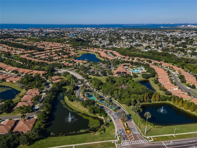 drone / aerial view featuring a water view and a residential view