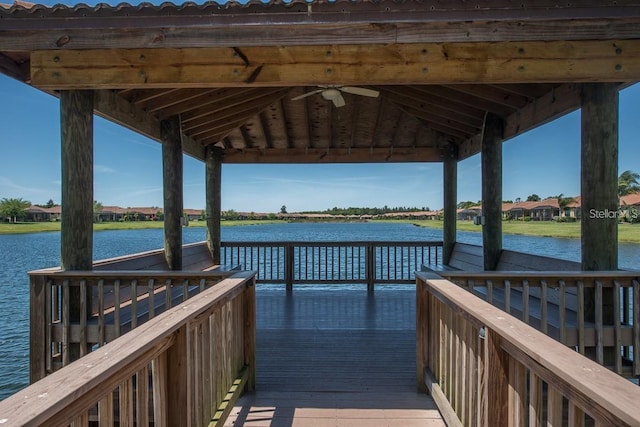 view of dock with a gazebo and a water view