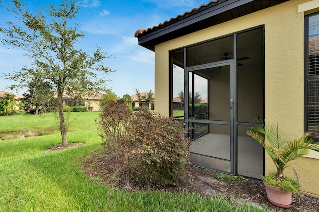 view of yard featuring a sunroom