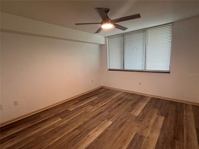 unfurnished room with wood-type flooring and ceiling fan