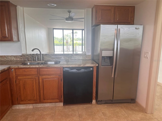 kitchen featuring stainless steel fridge, light tile patterned floors, ceiling fan, dishwasher, and sink