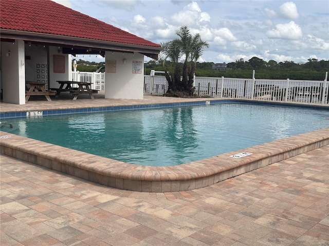 view of swimming pool featuring a patio area