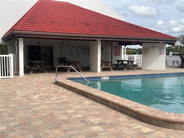 view of pool featuring a patio