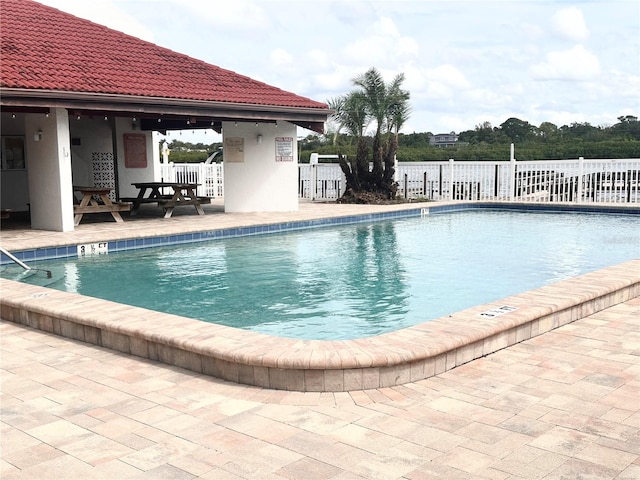 view of swimming pool featuring a patio area