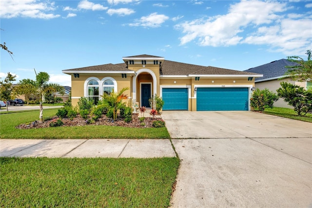 view of front of home with a garage and a front yard