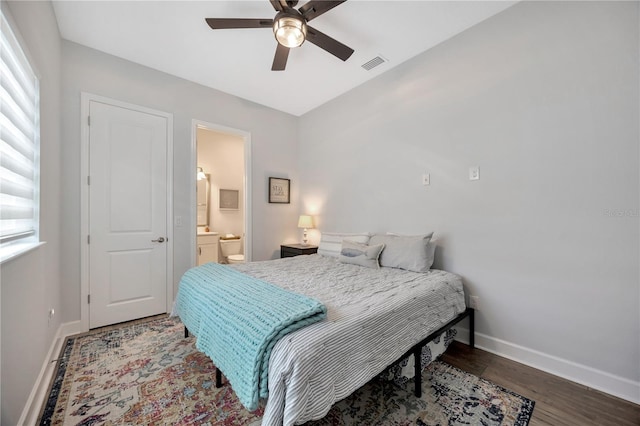 bedroom with ceiling fan, wood-type flooring, and connected bathroom