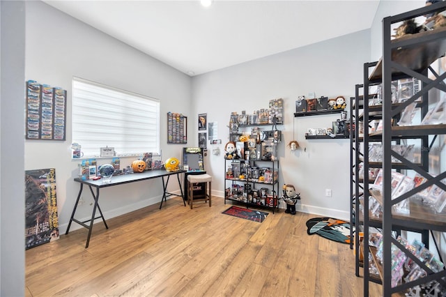 workout room featuring light wood-type flooring