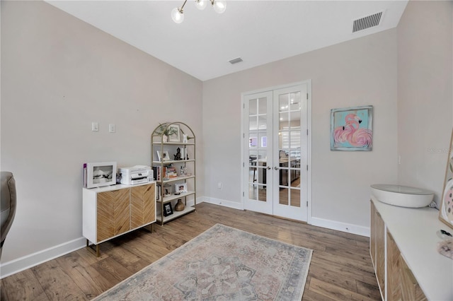 interior space with dark wood-type flooring and french doors