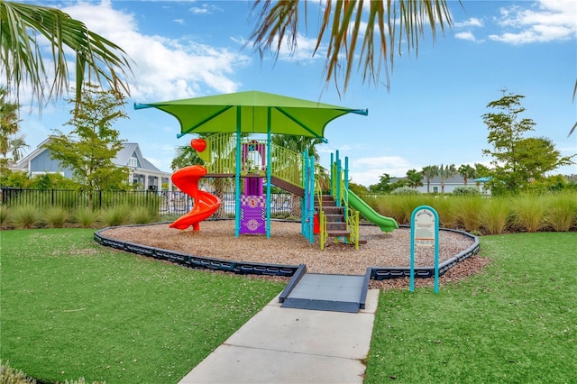 view of jungle gym featuring a lawn