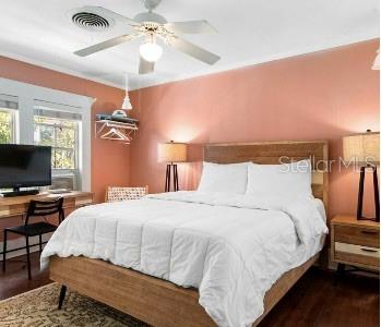 bedroom with dark wood-type flooring and ceiling fan